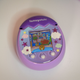 Photo of the purple Tamagotchi Pix laying on a table